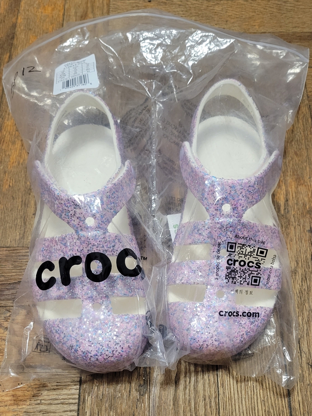 CROCS Kids' Glitter Jelly Sandals in Pink and Purple